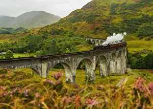 UK, Scotland, Highlands, Jacobite Steam Train crossing the Glenfinnan Viaduct