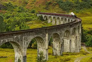 UK, Scotland, Highlands, Jacobite Steam Train crossing the Glenfinnan Viaduct