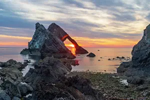 North Sea Prints: UK, Scotland, Moray, Portknockie, Moray Firth, Bow Fiddle Rock at Sunrise