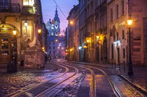 Ukraine, Lviv, Electric Commuter Trolley, Medieval Cobblestone Streets Ukraine, Lviv, Electric Commuter Trolley, Medieval Cobblestone Streets