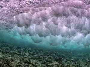 Power Prints: Underwater view of a large wave rolling breaking over a shallow reef system on Grand Cayman