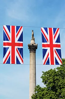 Images Dated 4th January 2023: Union flags and Nelsons Column, Trafalgar Square, London, England