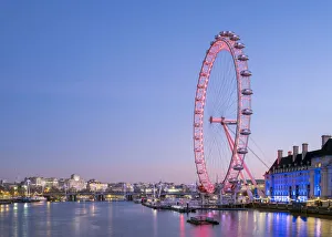 United Kingdom, England, London. London Eye observation wheel on the River Thames at dawn