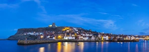 United Kingdom, England, North Yorkshire, Whitby. The harbour at dusk