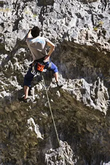United Kingdom, England, North Yorkshire, Malham. Rock Climber on Gordale Scar