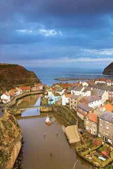 Images Dated 5th June 2014: United Kingdom, England, North Yorkshire, Staithes. The sleepy harbour in the evening