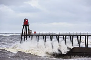 United Kingdom, England, North Yorkshire, Whitby. The East Pier during a Winter storm