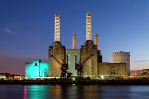 United Kingdom, UK, London, Battersea power station illuminated by colored light at dusk