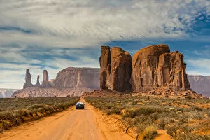 Unpaved road with scenic desert landscape, Monument Valley Navajo Tribal Park, Arizona