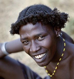 An unusual braided hairstyle of a Dassanech young man