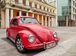 Images Dated 23rd September 2016: Uruguay, Montevideo, Red Volkswagen Beetle parked in front of the Estevez Palace