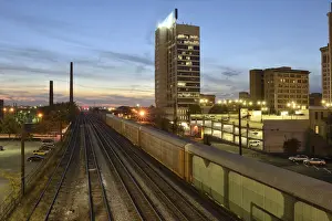 Birmingham Prints: USA, Alabama, Birmingham, train tracks in downtown at dusk