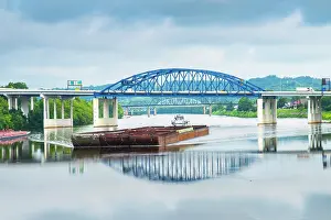 USA, Charleston, West Virginia, Capital City, Barge Glides Under The Eugene A. Carter Bridge On The Kanawha River in Downtown Charleston