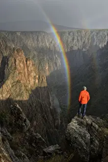 Thunderstorm Prints: USA, Colorado, Black Canyon of the Gunnison National Park, Man looking into canyon with