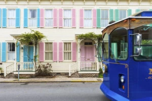 Images Dated 16th May 2016: USA, Georgia, Savannah, Woman walking past a row of colourful houses