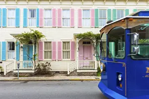 Historical District Prints: USA, Georgia, Savannah, Woman walking past a row of colourful houses