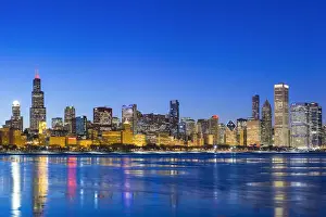 USA, Illinois, Chicago. The City Skyline and a frozen Lake Michigan from near