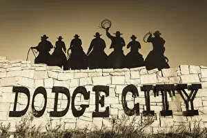 Images Dated 16th January 2013: USA, Kansas, Dodge City, city sign with cowboy silhouettes