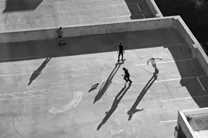 Play Prints: USA, Nevada, Reno, kids in Reno roller skating on parking garage roof
