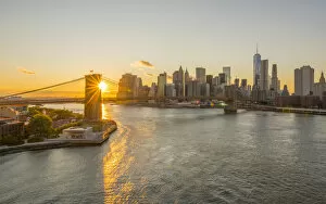 Images Dated 11th January 2016: USA, New York, Lower Manhattan Skyline and Brooklyn Bridge over East River at Sunset