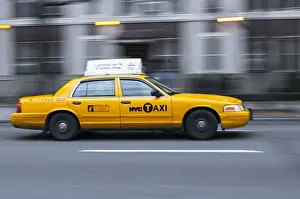 States Prints: USA, New York, New York City, yellow city cab speeding along a New York street