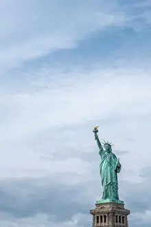 International Landmark Prints: USA, New York, Statue of Liberty. Isolated picture of the statue with sky and copy space