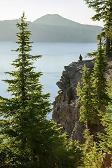 USA, Oregon, Crater Lake National Park, person watching sunrise