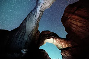 February Gallery: USA, Utah, Double Arches rock formations illuminated by night in the Arches National Park