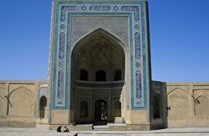 Bukhara Gallery: Uzbek men sit outside The Kalan Mosque