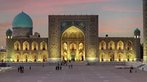 Images Dated 29th November 2022: Uzbekistan, Samarkand, Registan square, Tilya-Kori Madrasah lit up at night