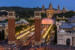 Venetian Towers with Magic Fountain light show and Palau Nacional in the background Venetian Towers with Magic Fountain light show and Palau Nacional in the background