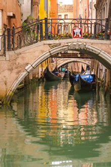 Images Dated 22nd October 2015: Venice, Veneto, Italy. Bridges and gondolas moored in a canal