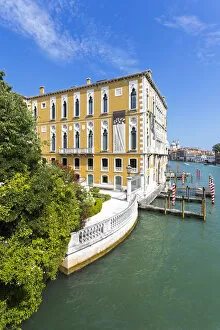 Venice, Veneto, Italy. Building with garden and canal