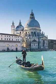 Venice, Veneto, Italy. Gondola over the Grand Canal with the Salute (St Mary of Health)