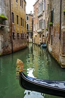 Gondola Prints: Venice, Veneto, Italy. Gondola sailing through a street canal