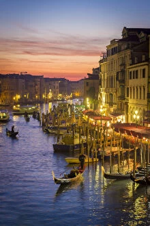 Venice, Veneto, Italy. Gondolas and the Grand Canal from Rialto Bridge at sunset