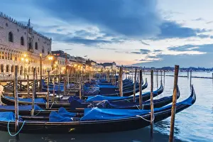 Street Lights Prints: Venice, Veneto, Italy. Gondolas moored on the waterfront of St Marks basin at dusk