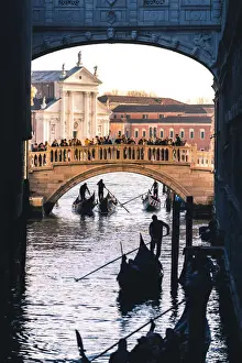 Gondoliers Prints: Venice, Veneto, Italy. Gondolas passing under the Bridge of Sighs
