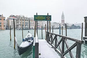 Images Dated 1st March 2018: Venice, Veneto, Italy. Gondolas on the waterfront with snow in Dorsoduro