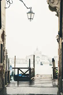 Venice Prints: Venice, Veneto, Italy. Pier on the waterfront in the mist and St Mary Of The Presentation