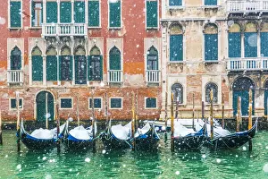 Canal Prints: Venice, Veneto, Italy. Snowfall over moored gondolas along the Grand Canal (Canal Grande)