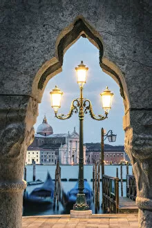 Venice, Veneto, Italy. St Marks waterfront and San Giorgio Maggiore at dusk