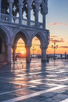 Images Dated 22nd January 2018: Venice, Veneto, Italy. Sunrise through the arches of Doges Palace in Piazzetta San Marco