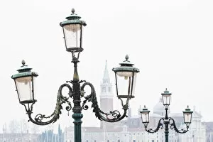 Images Dated 17th January 2018: Venice, Veneto, Italy. Typical street lamps and San Giorgio Maggiore in a misty morning