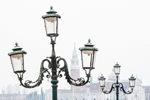 St Mark Square Prints: Venice, Veneto, Italy. Typical street lamps and San Giorgio Maggiore in a misty morning