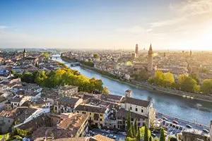 Verona, Veneto, Italy. High angle view of the old town and the Adige river at sunset