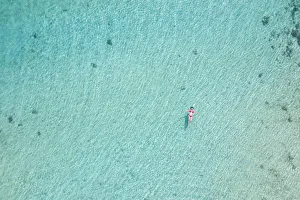Mauritius Prints: a vertical shot with beautiful girl enjoying the sea, Black River, Mauritius
