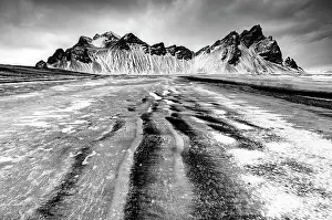 Southeast Iceland Prints: Vestrahorn mountain in winter, from the black sand beach at Stokksnes covered in snow and ice