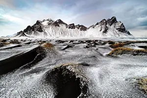 Southeast Iceland Prints: Vestrahorn mountain in winter, from the grassy black sand dunes covered in ice and snow