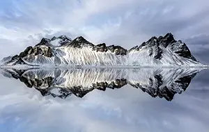 Southeast Iceland Prints: Vestrahorn mountain in winter, reflecting in the shallow water of a nearby lagoon